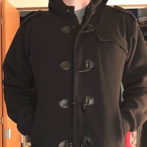Black jacket with wood pegs